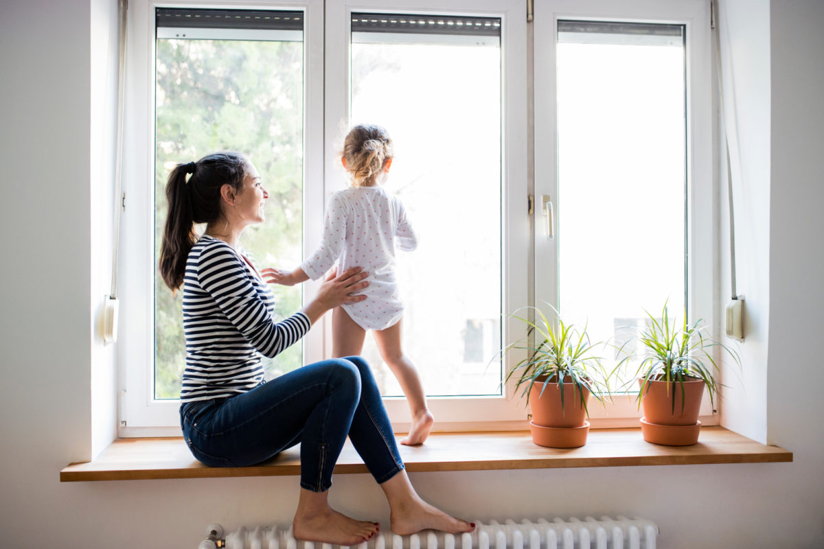 Picture of a kid in a window