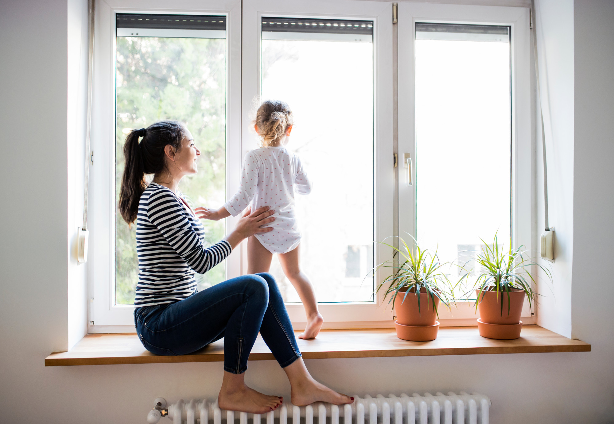 Picture of a kid in a window