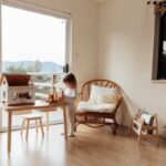Kid playing in a house with sliding glass doors