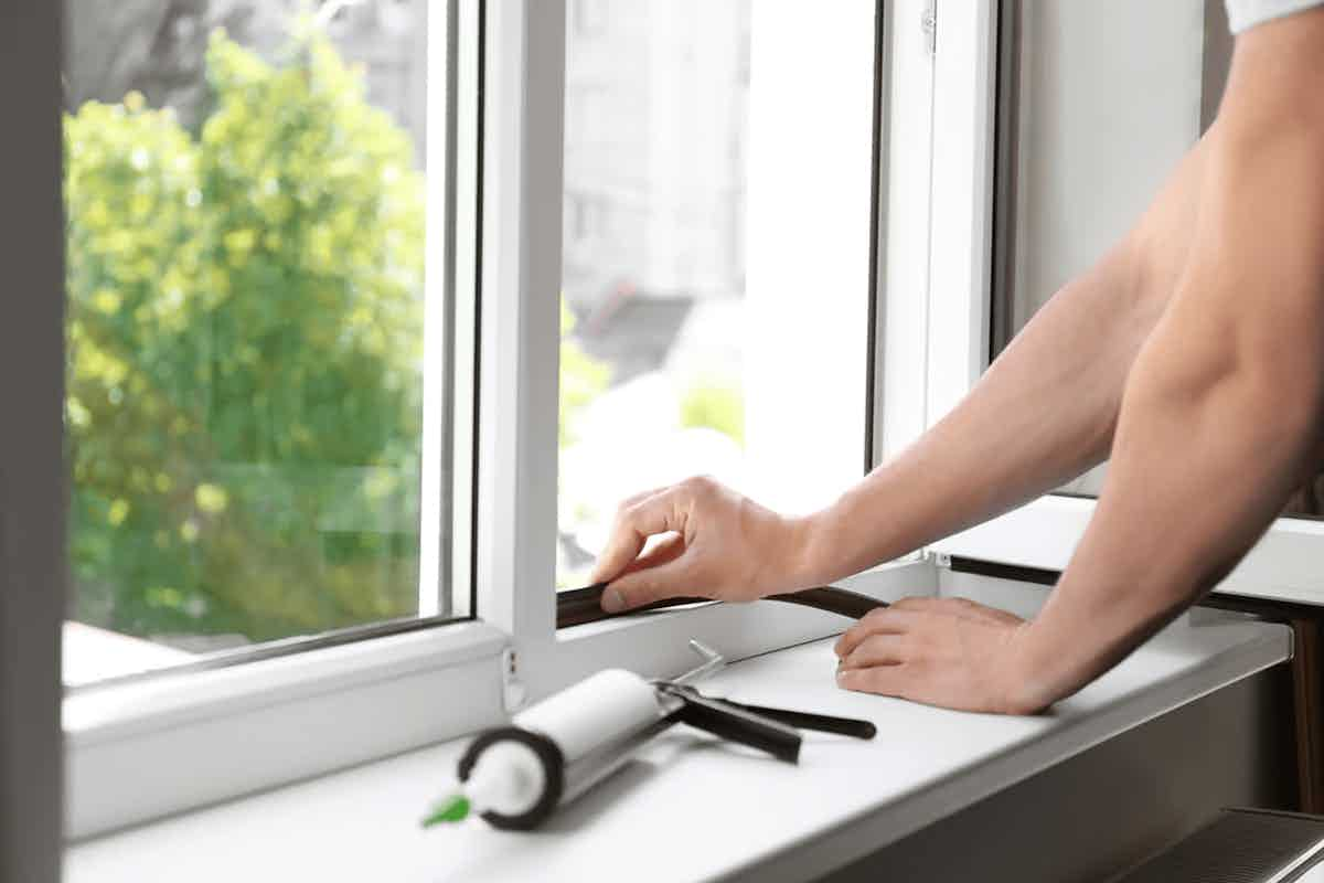 person doing a window repair