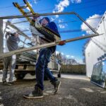 people performing window installation