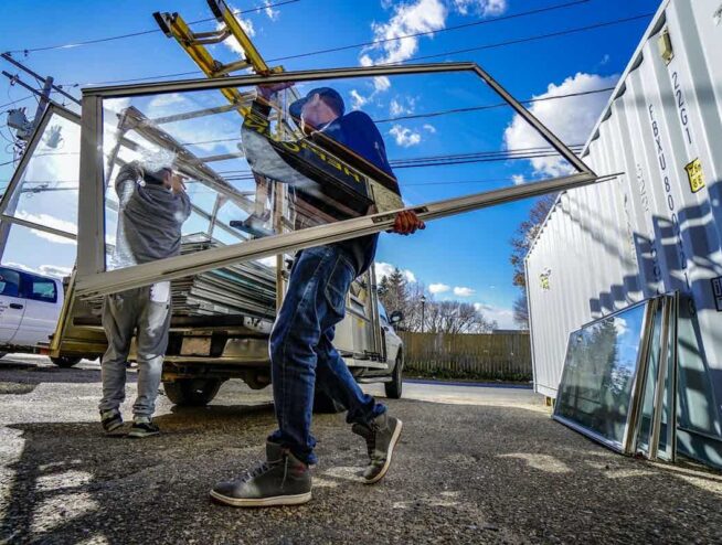 people performing window installation