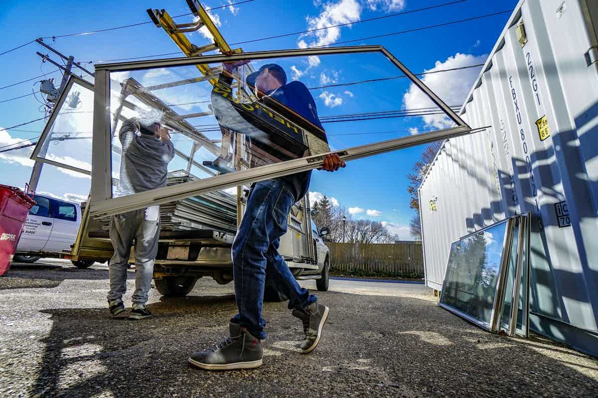 people performing window installation